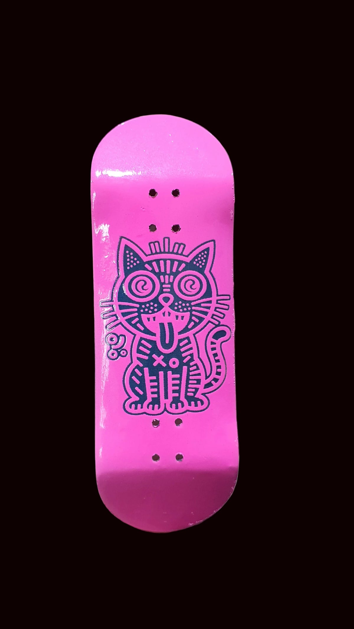 Pink fingerboard deck with large purple cat graphic and multiple bolt holes