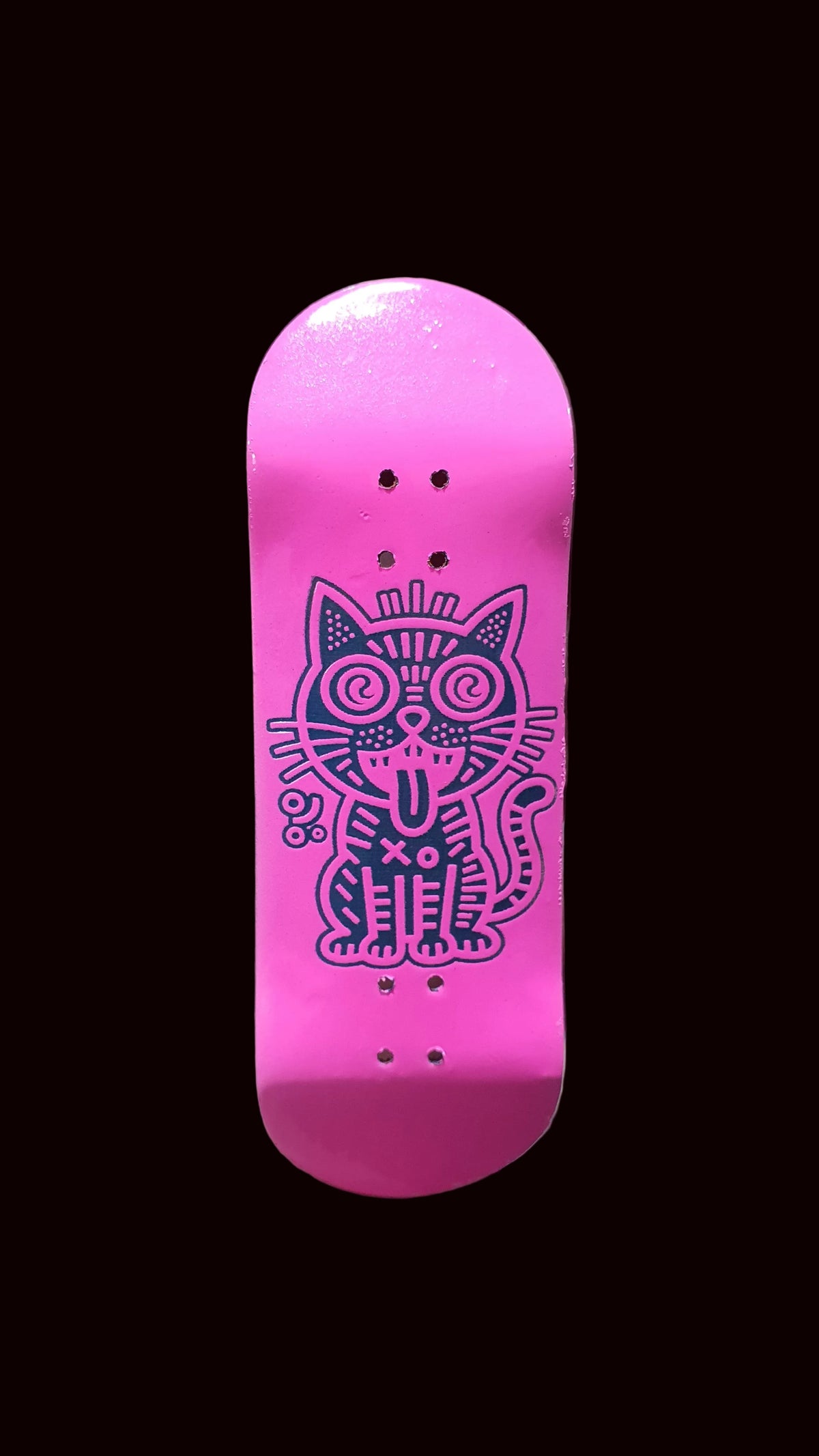 Pink fingerboard deck with purple cat graphic and multiple bolt holes