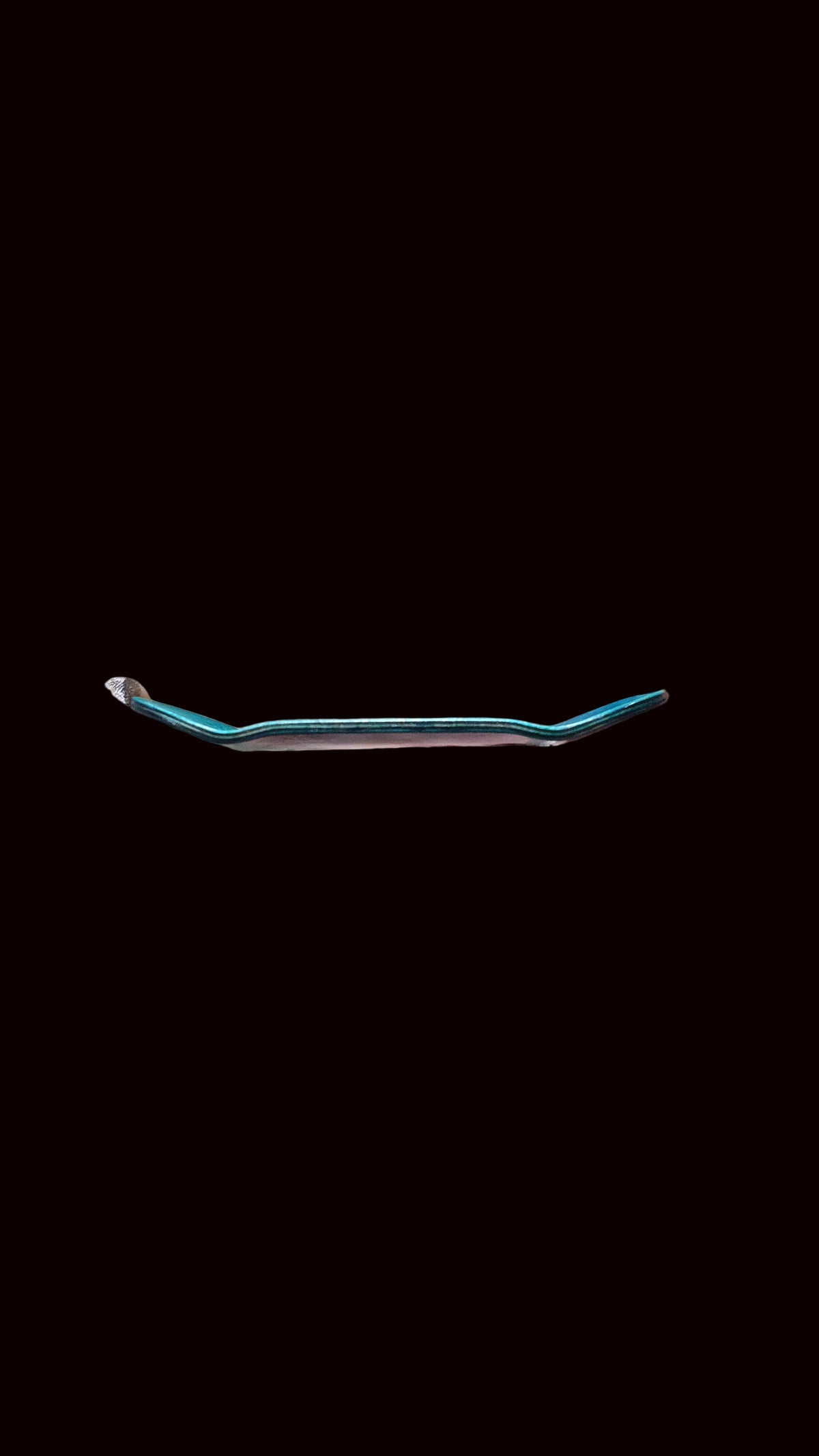 Metal fingerboard tool with curved, narrow tips and blue-tinted finish.