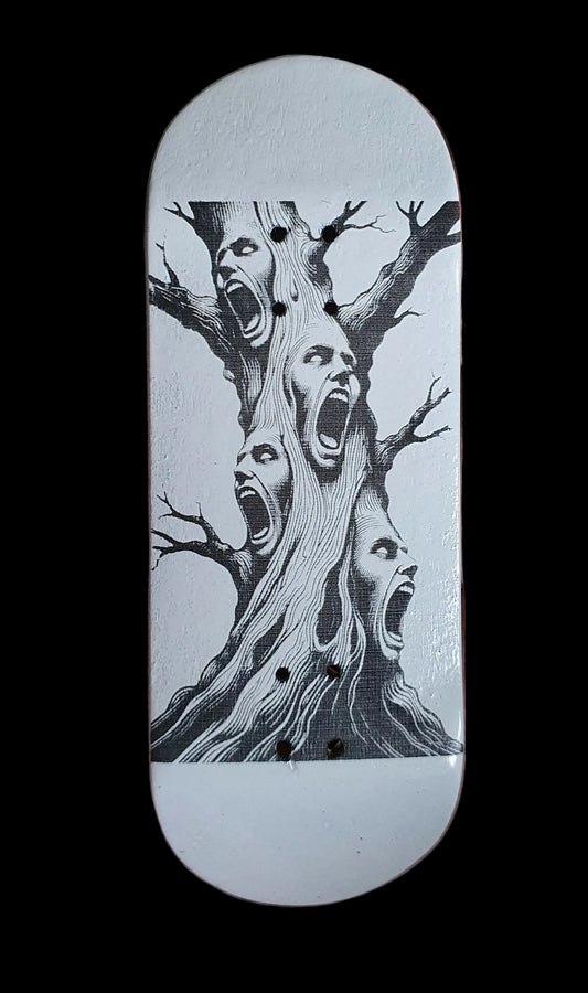 Skateboard deck with white base and black tree-screaming face graphic