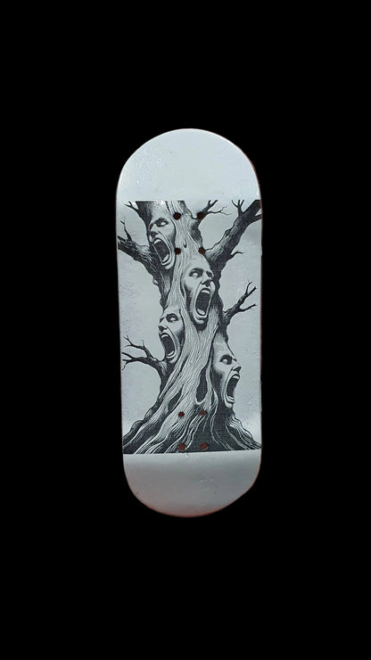 Skateboard deck with tree-screaming face artwork on light-colored grip surface