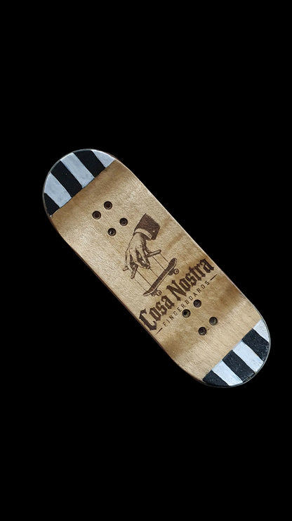 Skateboard deck bottom angled view with tan grip and blue-black striped ends