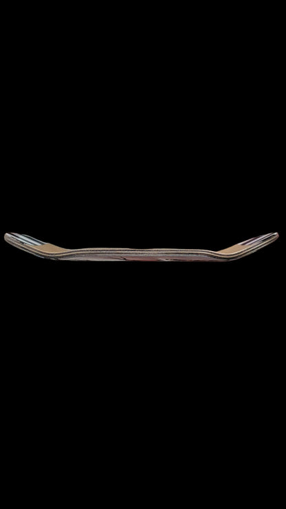 Skateboard deck side profile view with layered wood edge