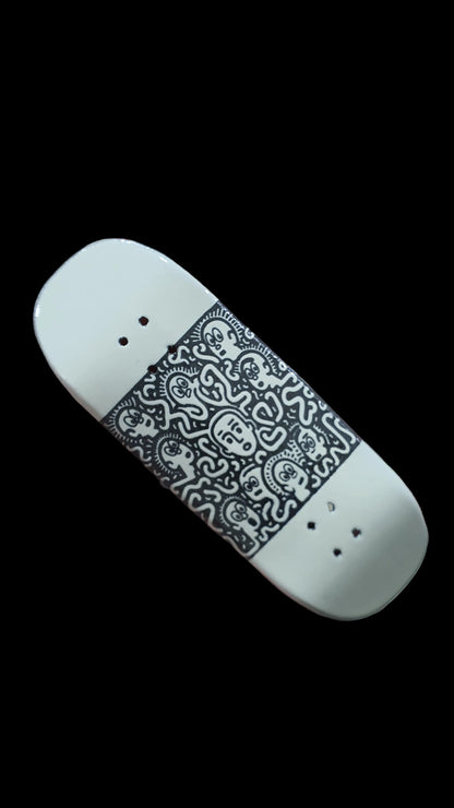 Confusion fingerboard deck with black-and-white graphic panel and four mounting holes