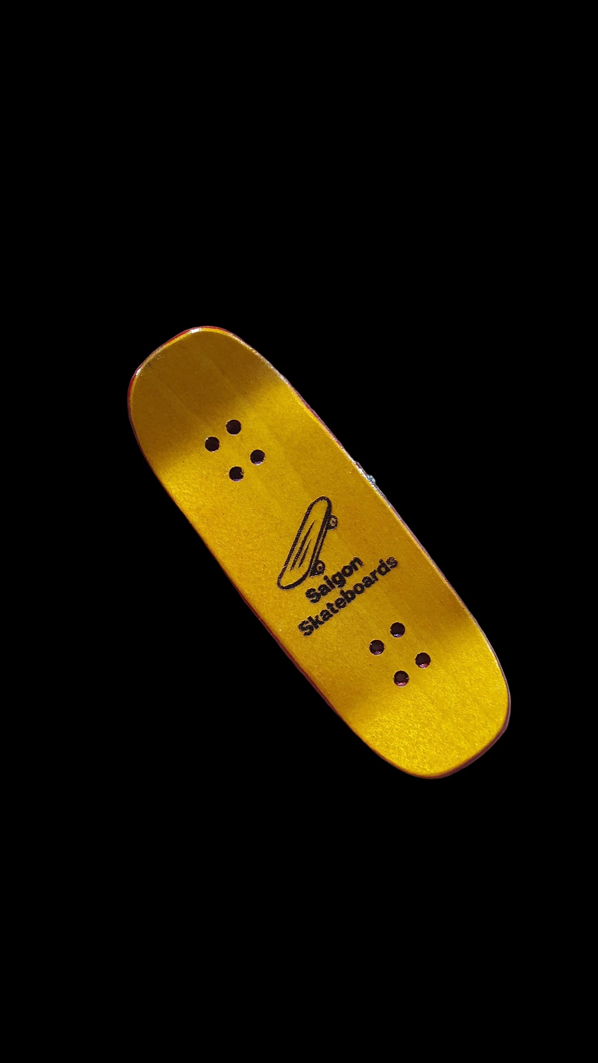 Saigon Skateboards fingerboard deck underside, yellow maple with logo and four mounting holes