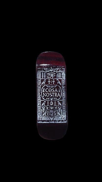 Fingerboard deck underside with red-brown finish and centered white Cosa Nostra design