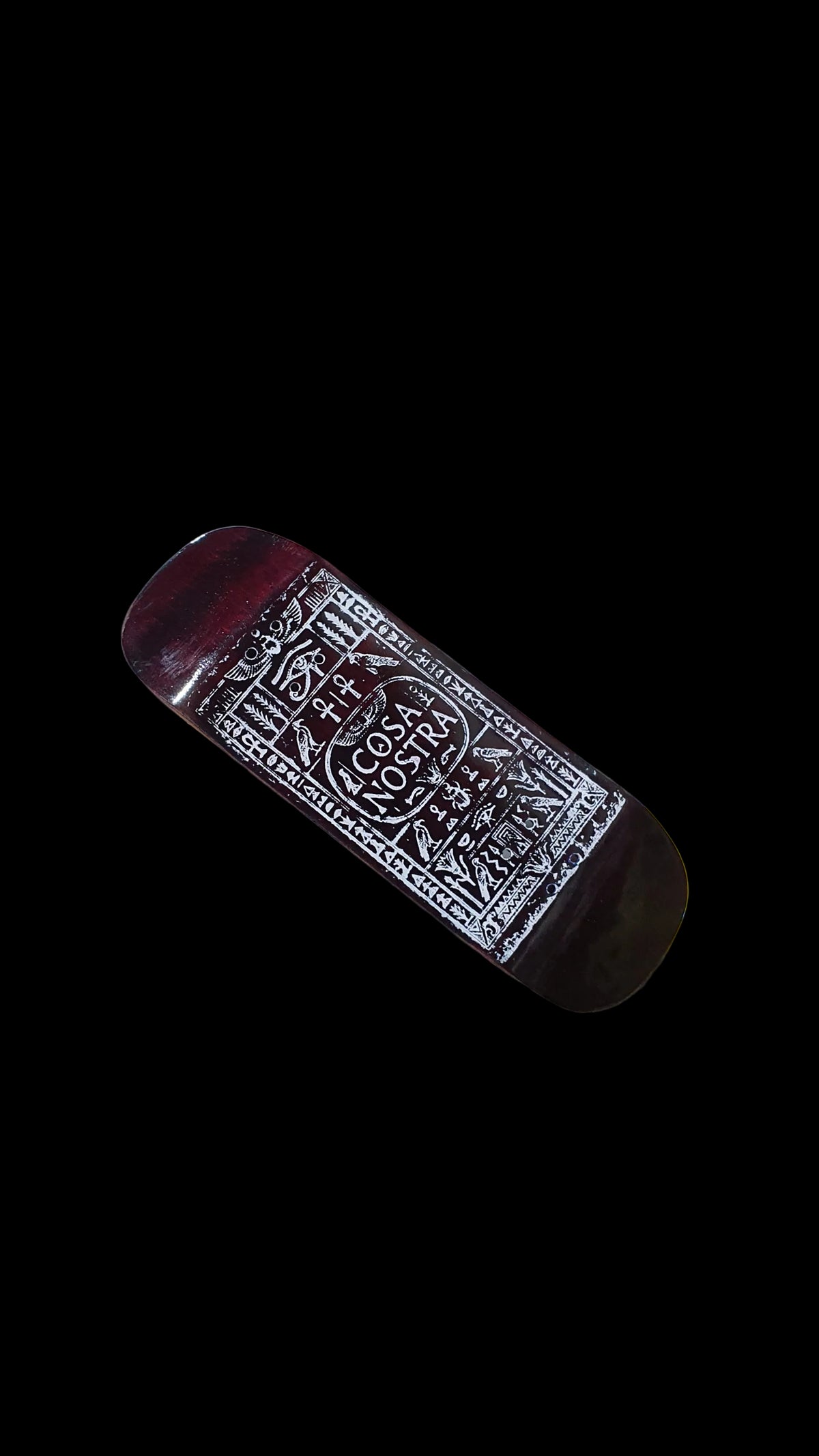 Cosa Nostra fingerboard deck with ornate white graphic, shown diagonally