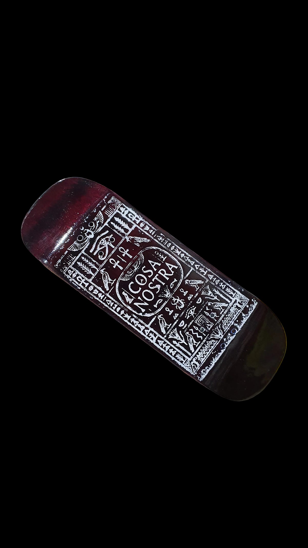 Cosa Nostra fingerboard deck with ornate white graphic, shown at an angle