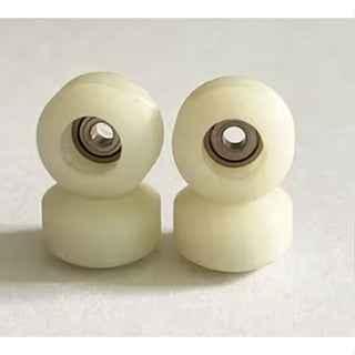 Pair of white miniature fingerboard wheels for custom fingerboard setups