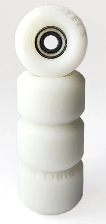 Four white miniature fingerboard wheels stacked vertically on a plain background.