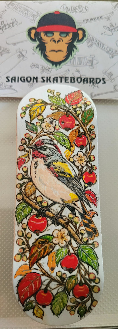 Bird graphic fingerboard deck with colorful floral and cherry design