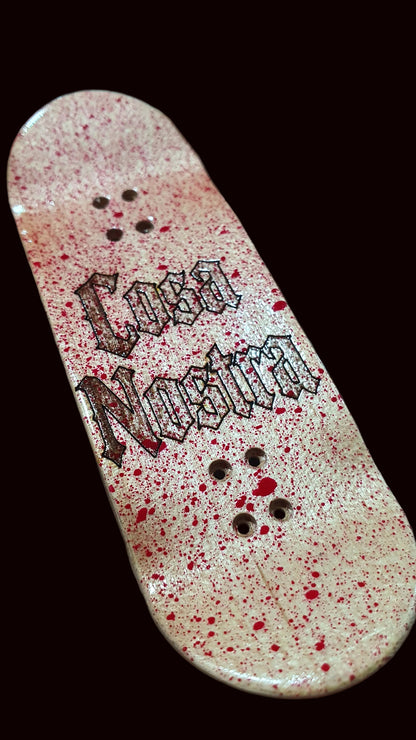 Popsicle fingerboard deck, white-pink speckled finish with black text graphic and mounting holes