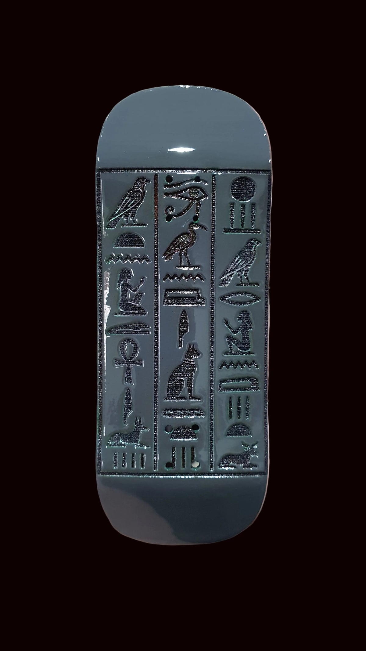 34mm fingerboard deck, silver tone with detailed hieroglyph-style embossed artwork