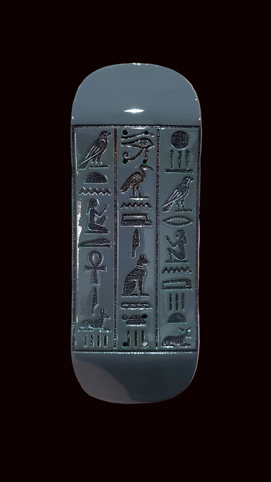 34mm fingerboard deck, silver tone with detailed hieroglyph-style embossed artwork