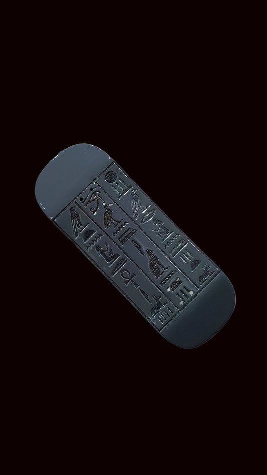 34mm fingerboard deck, angled view of gray-silver tone with embossed Egyptian tablet