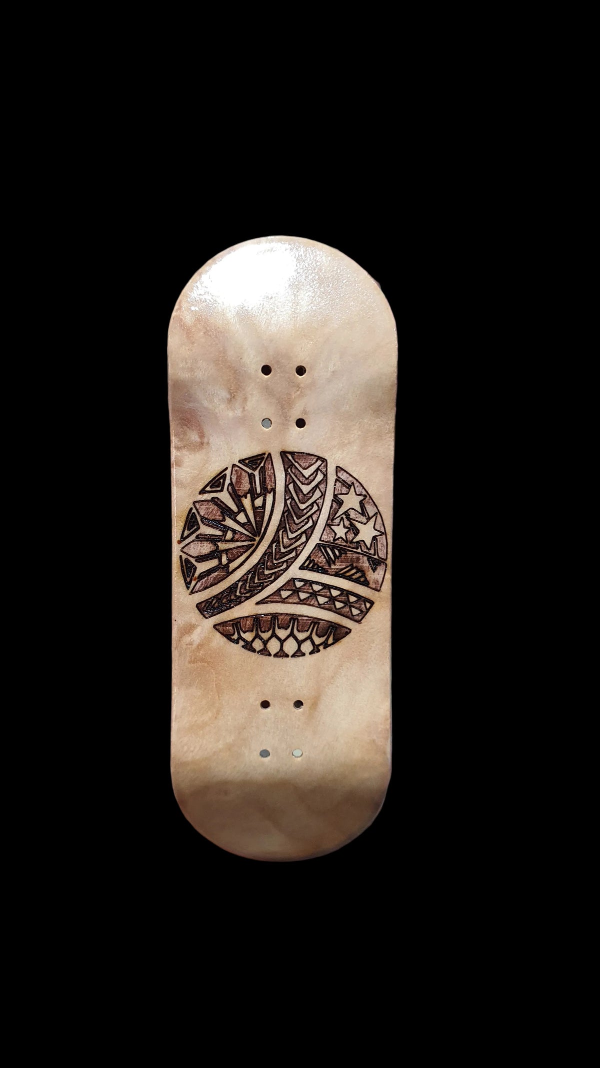 Fingerboard deck in light wood with carved graphic and 4 mounting holes