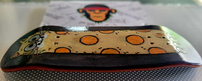 Fingerboard deck top with cat face and orange polka dots on a yellow panel