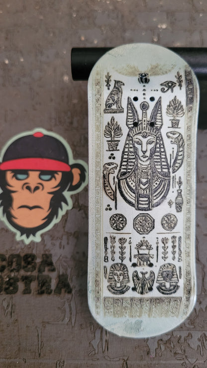 Decorative skateboard deck with intricate designs on a textured surface