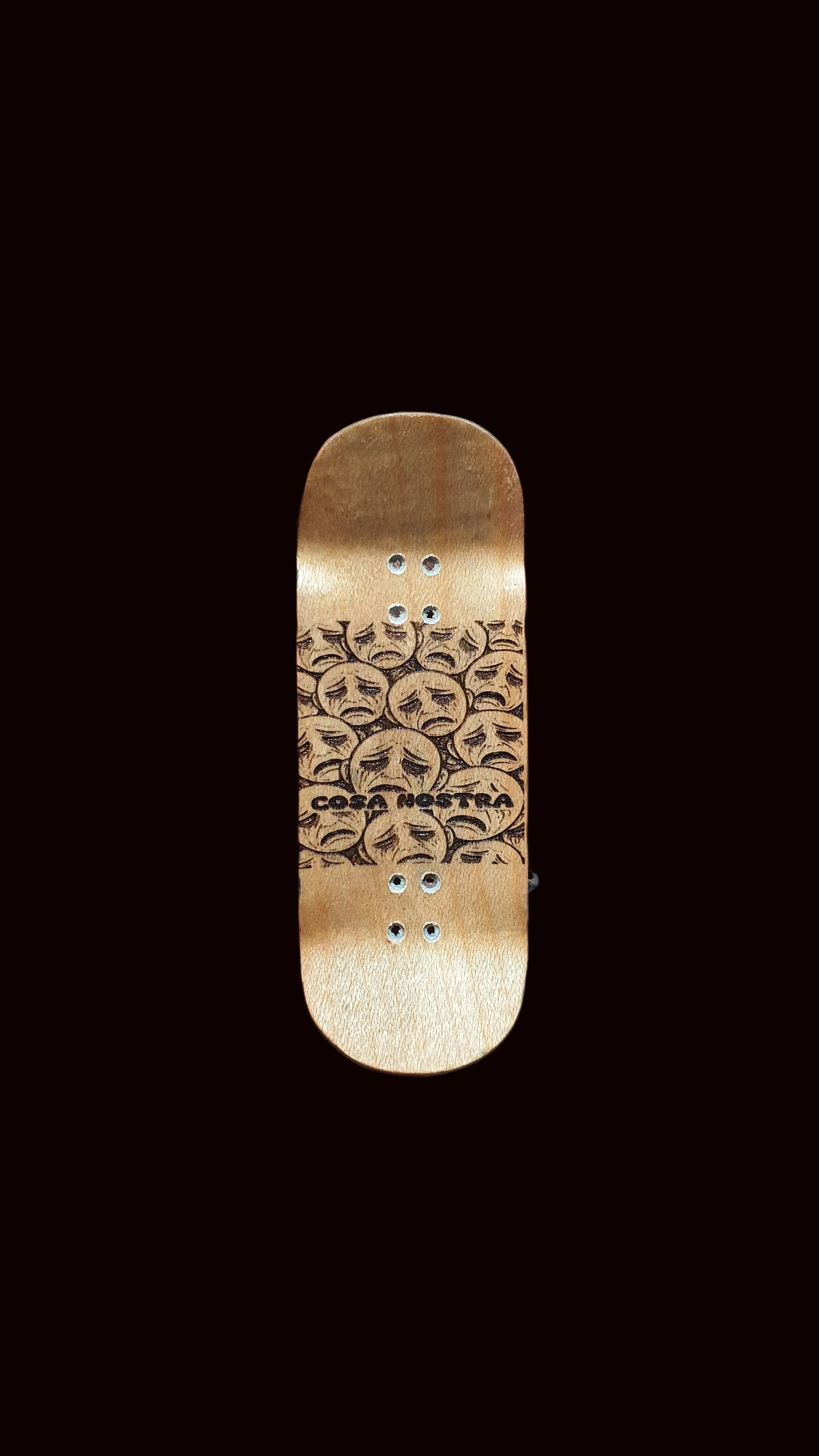 Gold fingerboard deck with line-art faces and Cosa Nostra logo