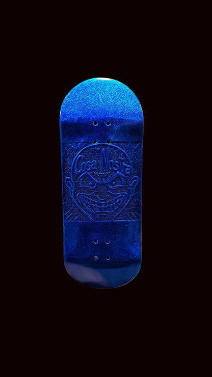 Blue fingerboard deck front view with embossed Cosa Nostra emblem and four holes
