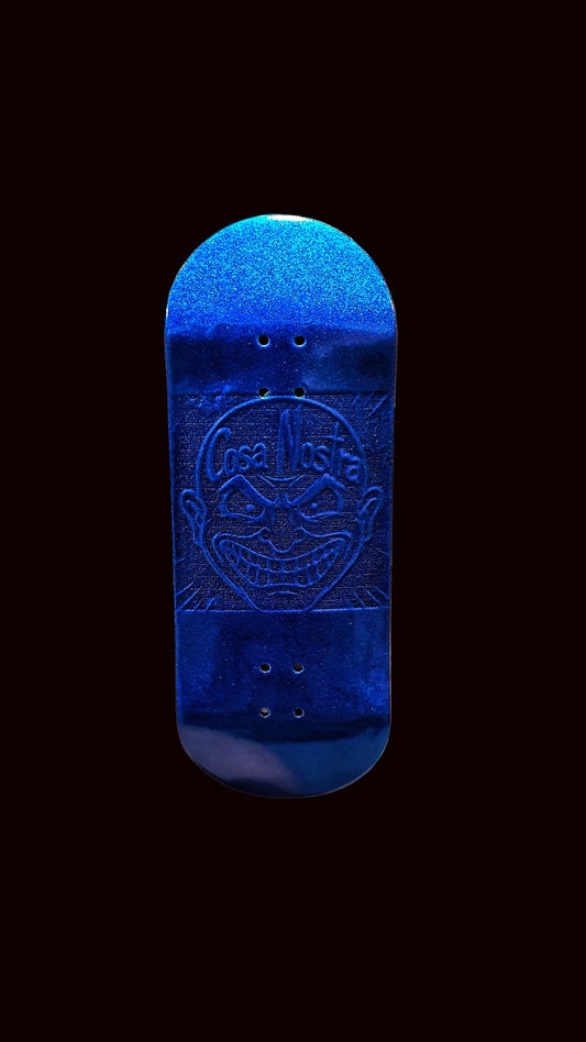 Blue fingerboard deck front view with embossed Cosa Nostra emblem and four holes