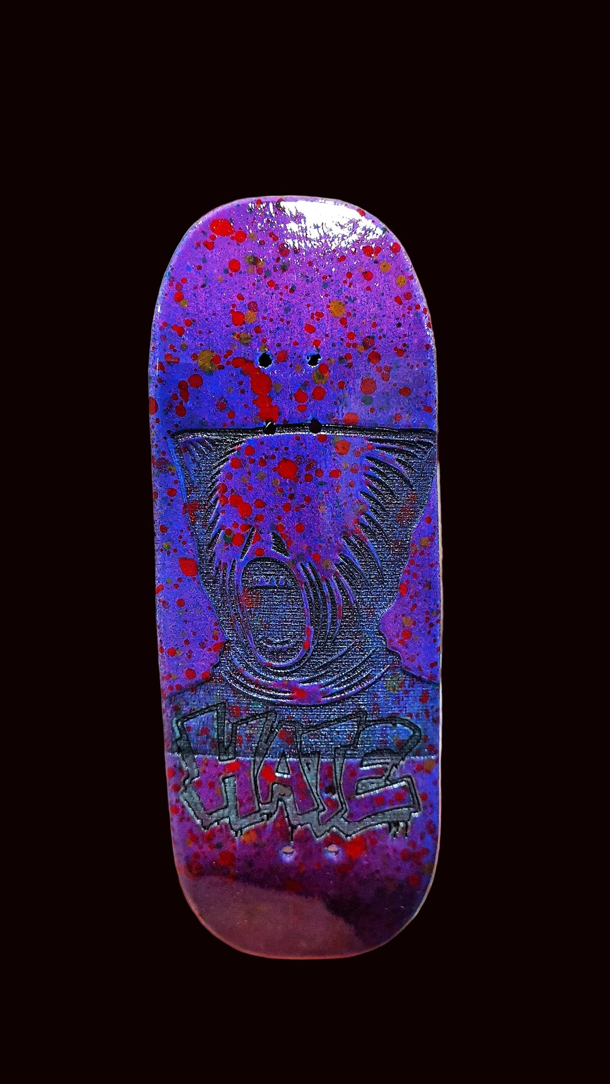 Purple fingerboard deck with glossy splatter finish and centered animal face graphic.