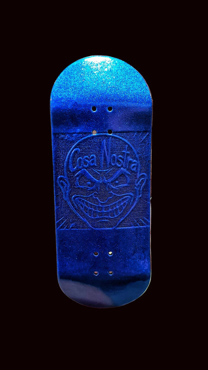 Blue fingerboard deck front view with Cosa Nostra emblem and four mounting holes
