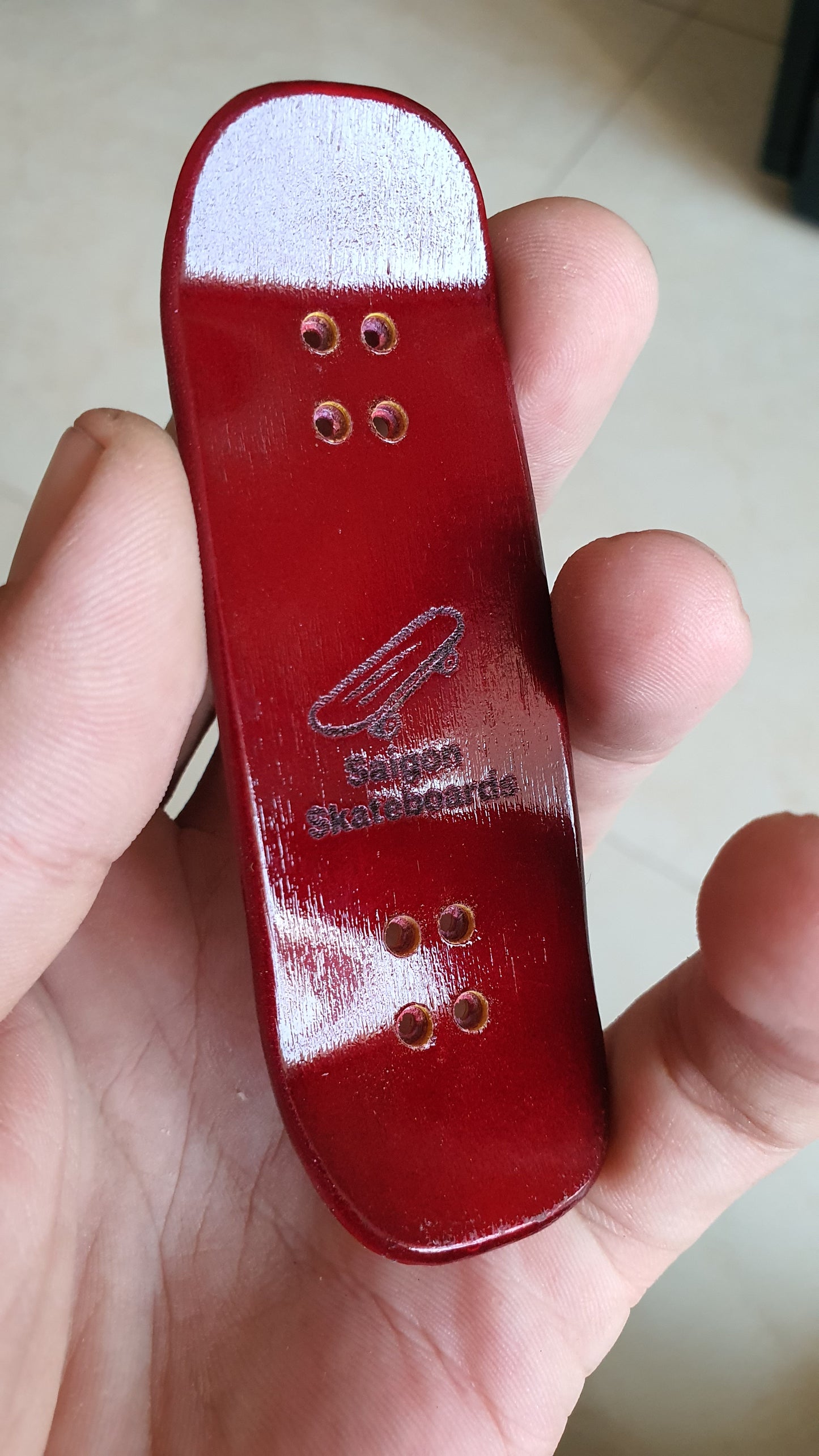 Saigon Skateboards 5-ply Canadian Maple "Blood" logo board. 32×97mm boxy shape. Medium kicks. High gloss finish.