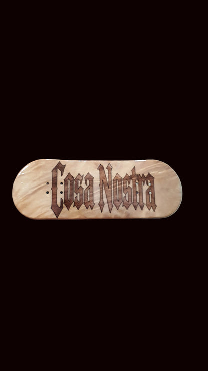 Natural wood fingerboard deck with large brown Cosa Nostra logo