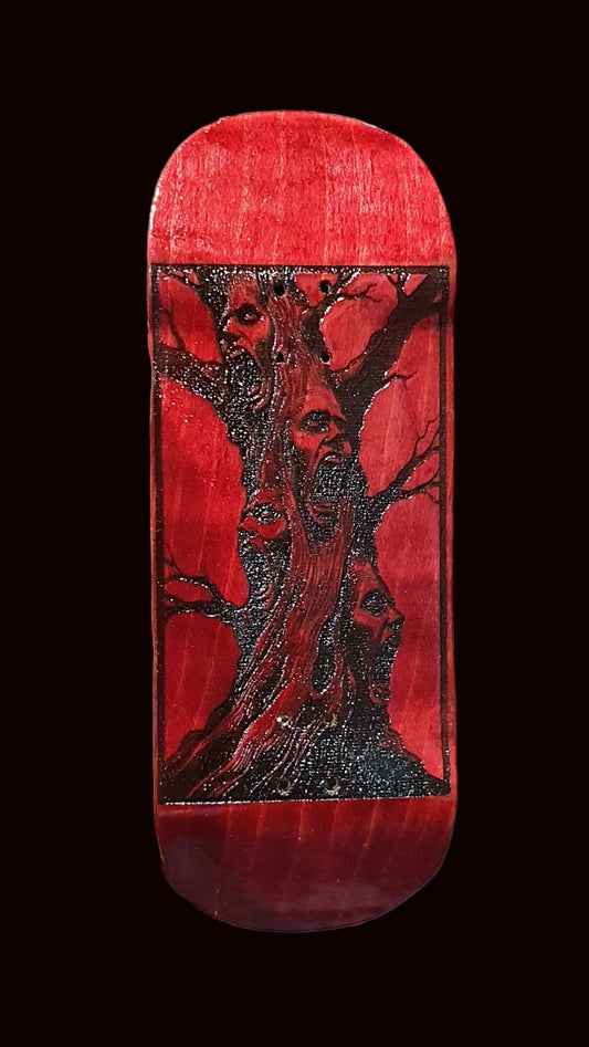 Red fingerboard deck with deer graphic and speckled glitter top