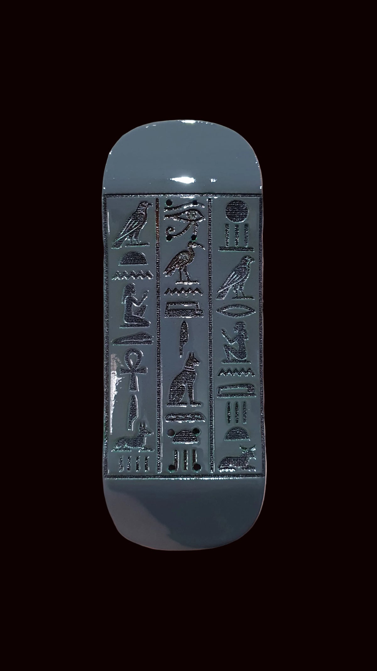34mm fingerboard deck, silver tone with embossed Egyptian symbols and front nose curve