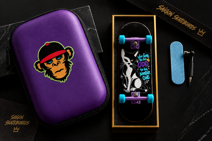 Purple fingerboard deck in zip case; boxed kit includes wheels and sticker.