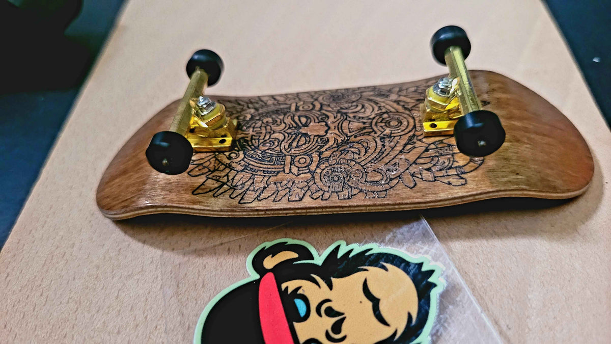Elevate Your Skills with the Ornate Aztec Warrior Fingerboard Deck - 34mm