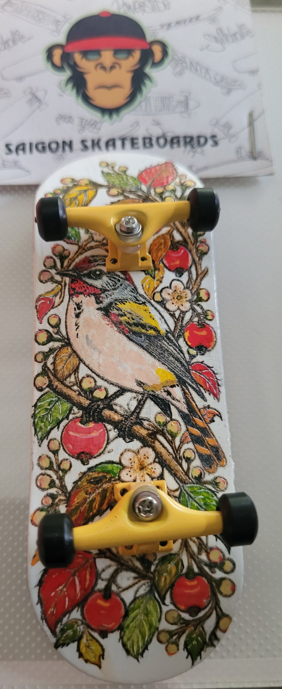 Complete finger skateboard with bird, floral and cherry graphic deck
