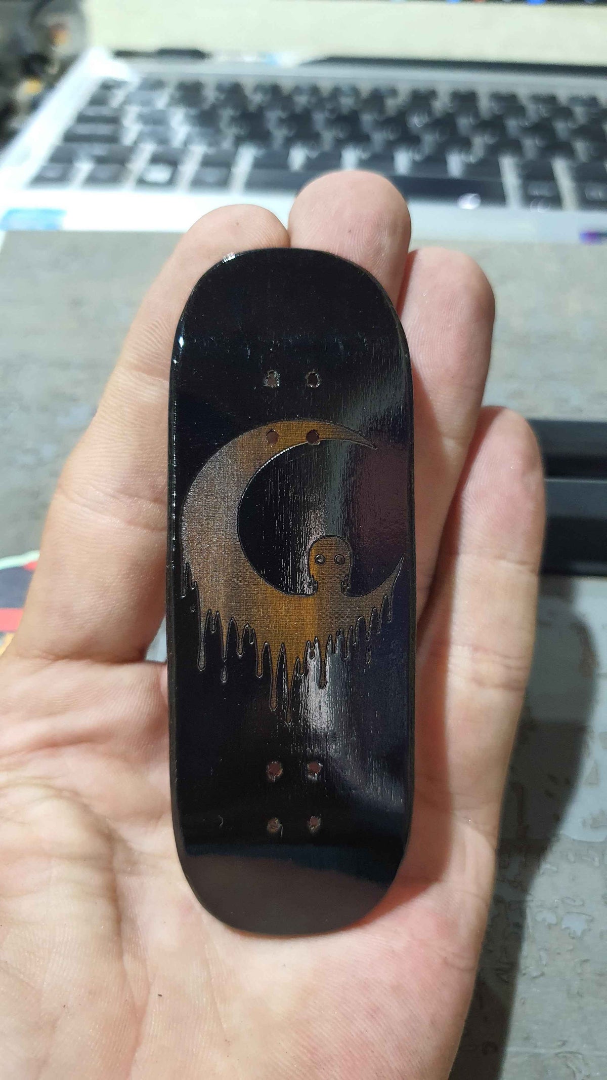 Achieve Precision and Style with the Saigon Skateboards Man in the Moon 34mm Fingerboard Deck