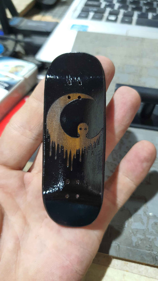 Achieve Precision and Style with the Saigon Skateboards Man in the Moon 34mm Fingerboard Deck
