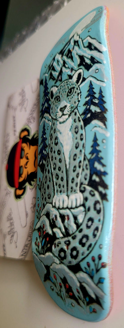 Teal finger skateboard deck corner view with snow leopard and trees graphic