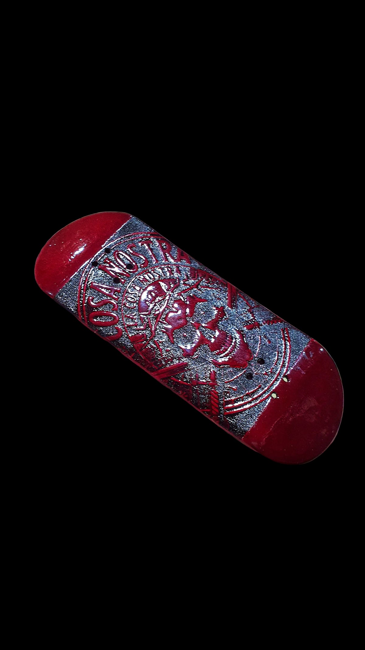 Red fingerboard deck angled view with Cosa Nostra skull graphic strip