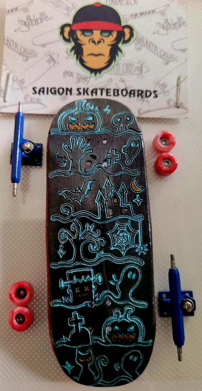 Complete skateboard with blue Ghost Town graphics, red wheels, and blue trucks