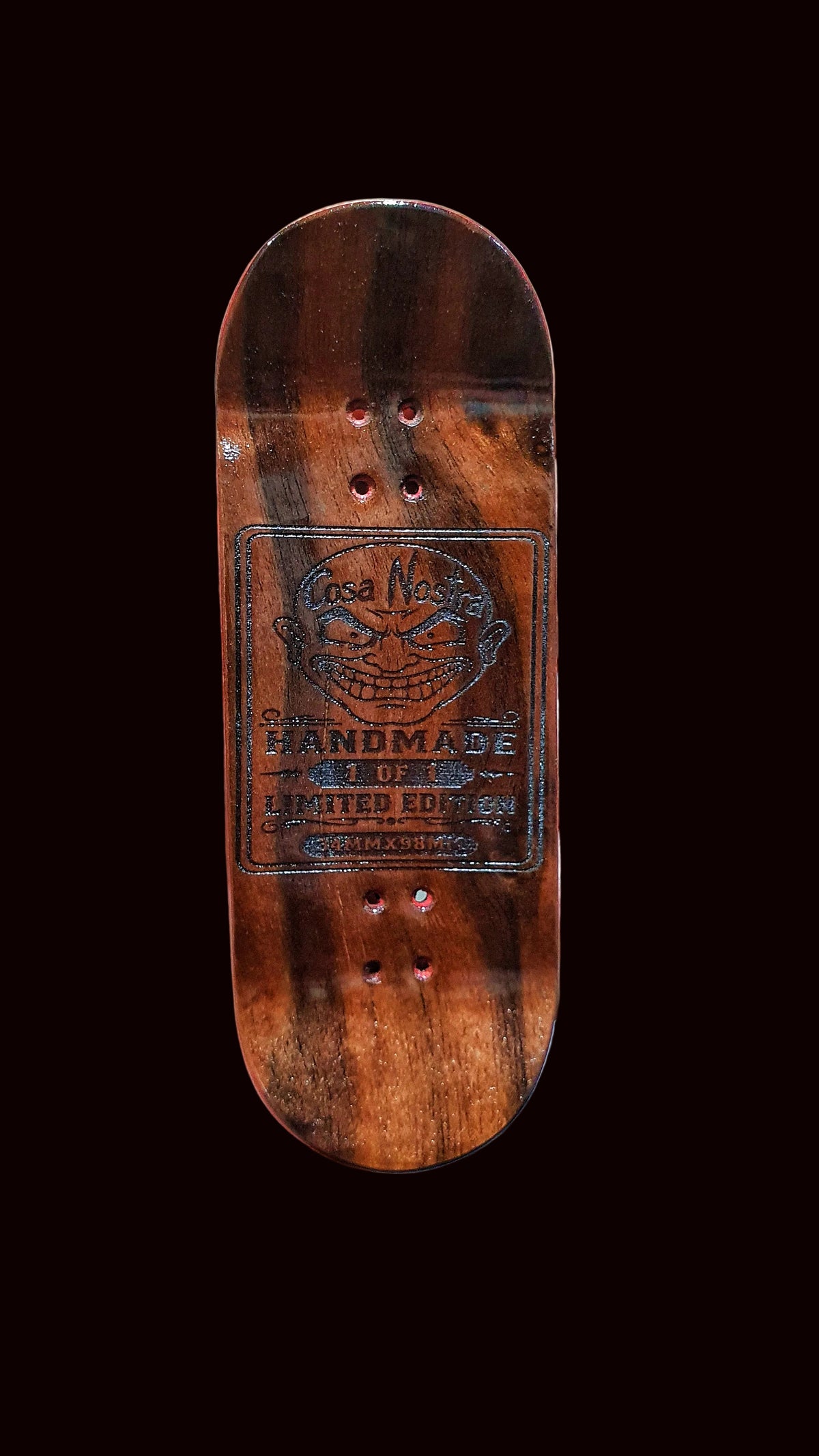 Fingerboard deck, dark wood with two mounting holes and circular handmade artwork