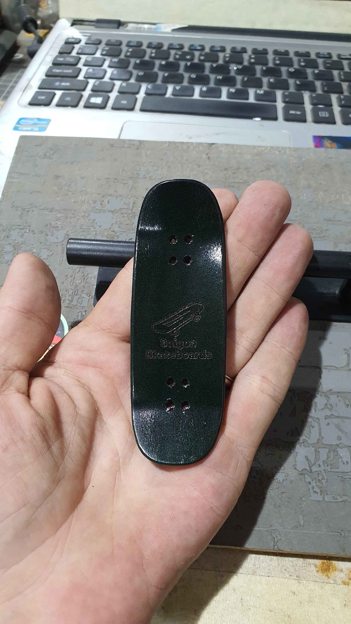 Achieve Precision and Style with the Saigon Skateboards Man in the Moon 34mm Fingerboard Deck