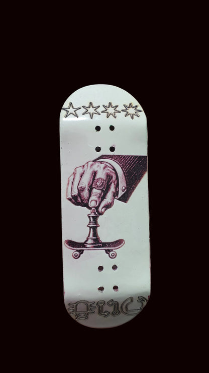 White fingerboard deck with purple boxing-hand artwork, stars at top, and dot holes