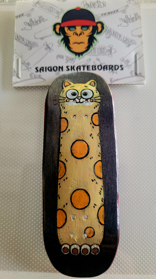 Fingerboard deck with cat graphic, dark sides, yellow speckled background