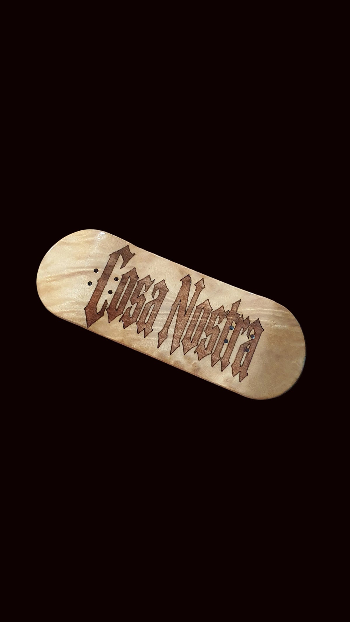 Natural wood fingerboard deck with brown logo graphic on top
