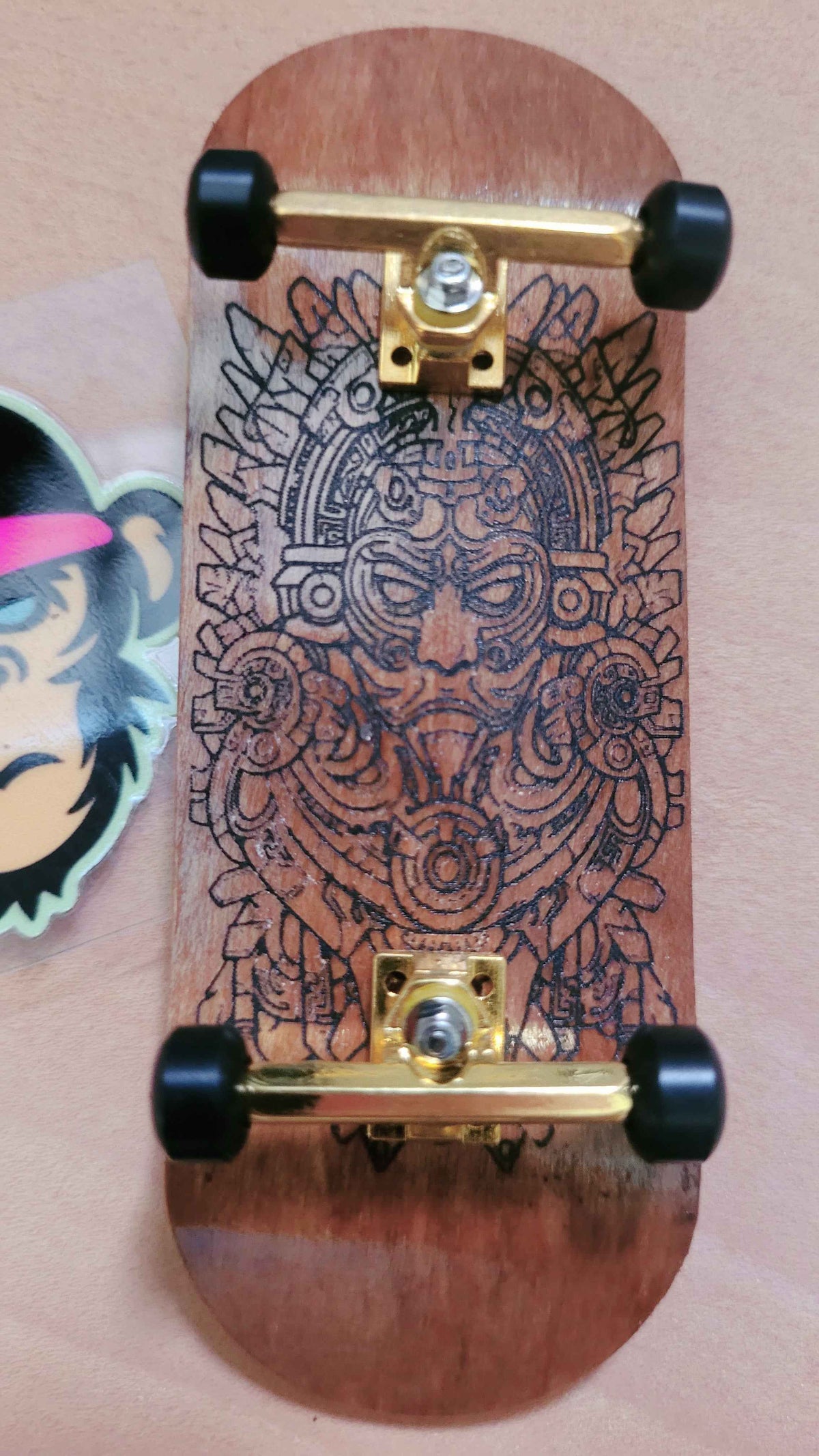 Elevate Your Skills with the Ornate Aztec Warrior Fingerboard Deck - 34mm