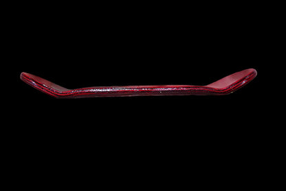 Red fingerboard deck side view showing curved underside and lip