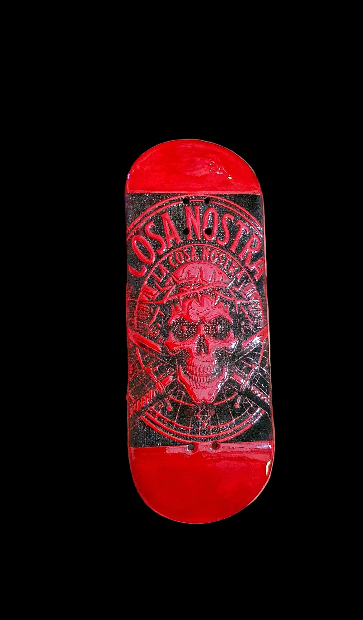 Red fingerboard deck, top view with Cosa Nostra graphic skull logo