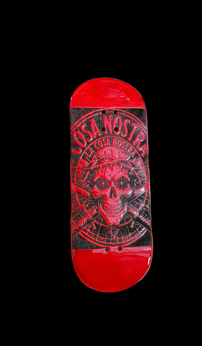 Red fingerboard deck, top view with Cosa Nostra graphic skull logo